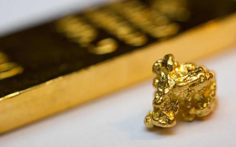 Close-up of a gold-bar and gold-nugget