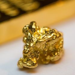 Close-up of a gold-bar and gold-nugget