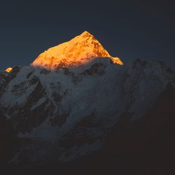 Evening sun paints the peaks of the Himalayan Mountain Range in Asia. 