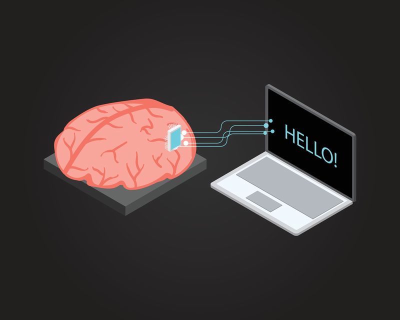 illustration of a brain with a chip connected to a laptop displaying the word "hello"