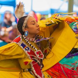 A closeup of a dancing Native American Woman with her eyes closed at the annual Delta Park Pow Wow in Portland, Oregon