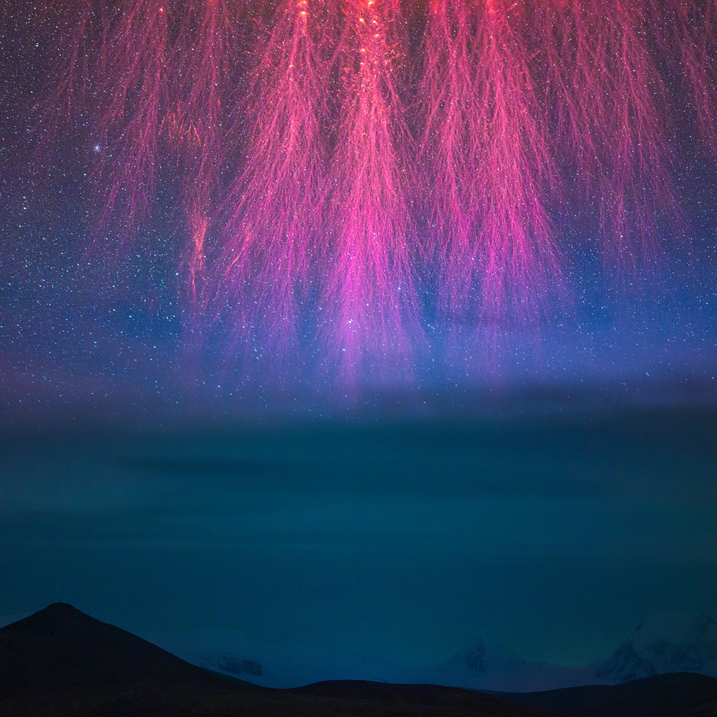 Pink firework-like sprites against a starry sky.