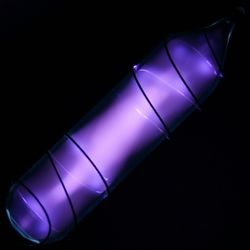 A vial of ultrapure oxygen with a purple glow.