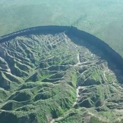 View of the Batagaika crater, as permafrost thaws causing a megaslump in the eroding landscape, in Russia's Sakha Republic in this still image from video taken July 11 or 12, 2023. 