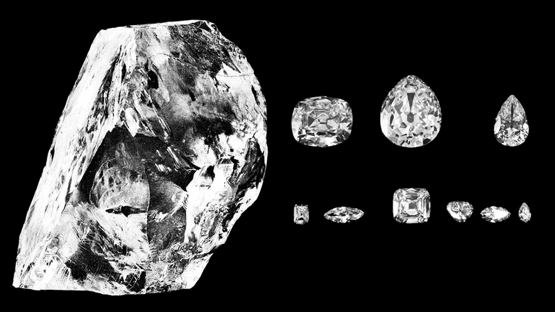 The uncut Cullinan Diamond on the left and then the nine cut diamonds it became shown on the right on a black background.