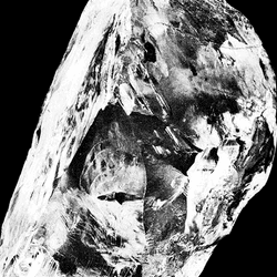 The uncut Cullinan Diamond on the left and then the nine cut diamonds it became shown on the right on a black background.