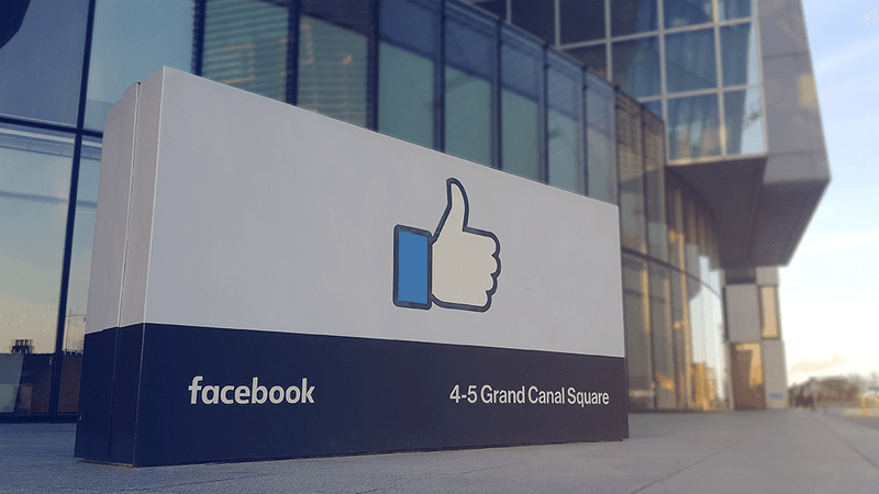 A Facebook sign outside an office building.