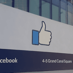 A Facebook sign outside an office building.