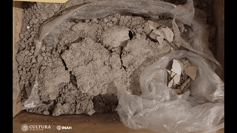 Flamingo egg in a box of grey stone and gravel 