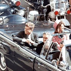 President Kennedy in the limousine in Dallas, Texas, minutes before his assassination.