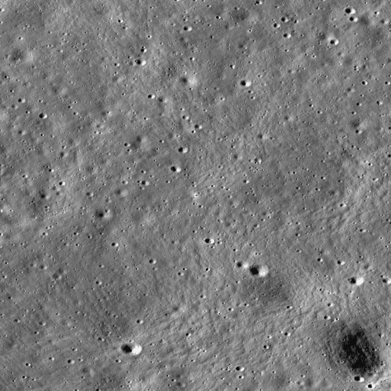 Aerial view of the Moon where vikram has landed. a few craters are seen among the gray soil